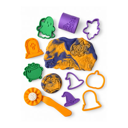 Halloween dough with cutters, stamps, a stamp cube and an orange roller
