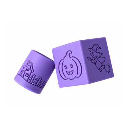 Purple Halloween stamp cube beside a cylindrical stamp