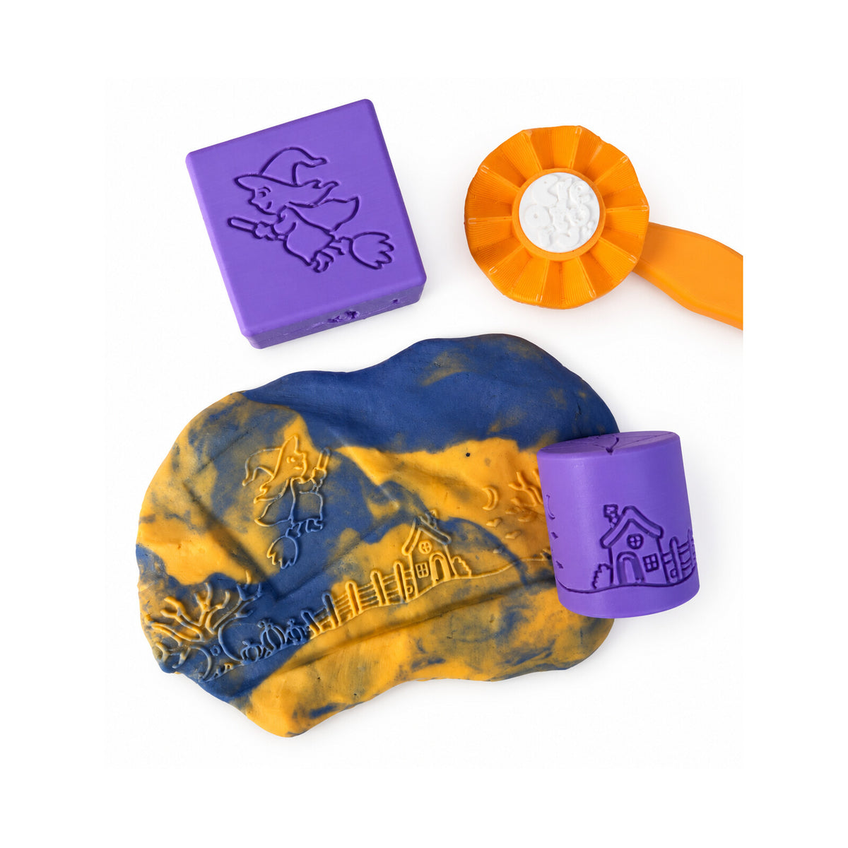 Halloween dough impressions beside purple stamps and an orange roller