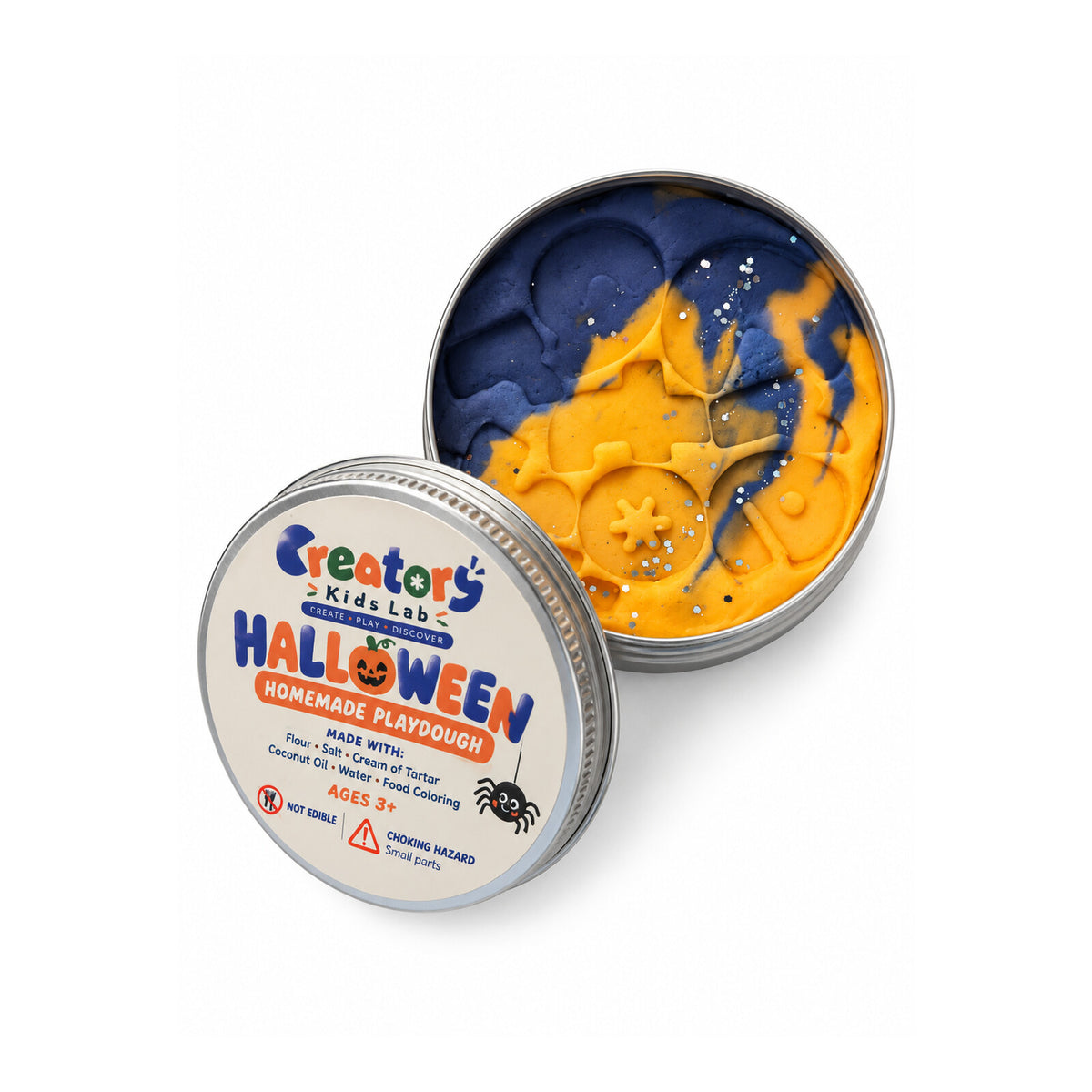 Open tin of orange and purple Halloween playdough