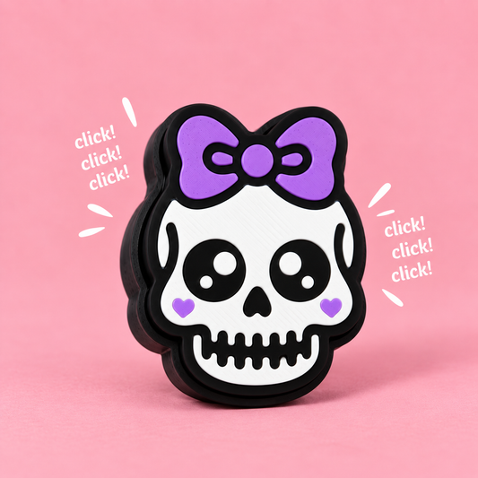 Sweet Skull Fidget Clicker on a pink background with click lettering