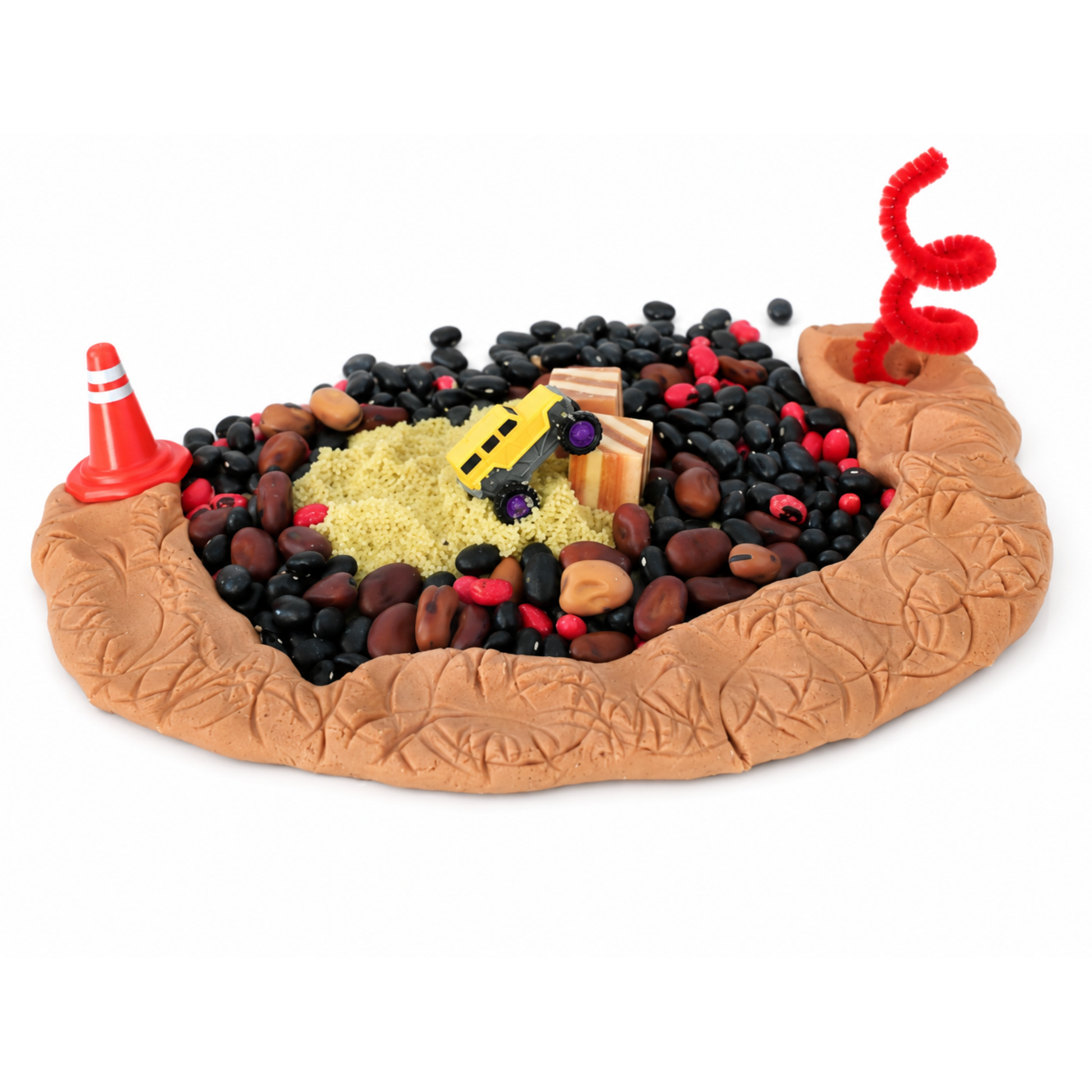 Child playing with construction sensory bin