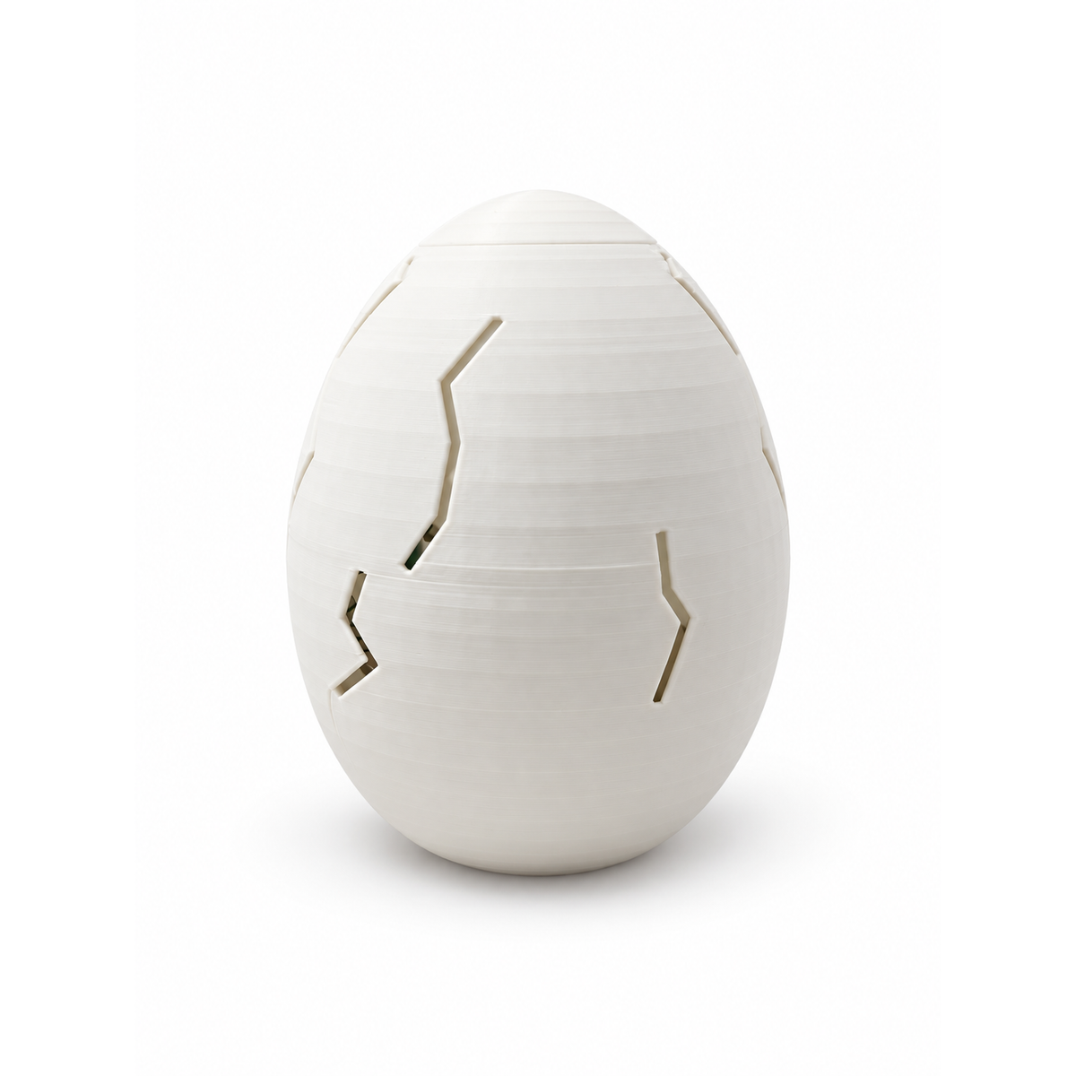 Closed white outer egg included with the Little Hatchling Dino Clicker and Dino & Me duo
