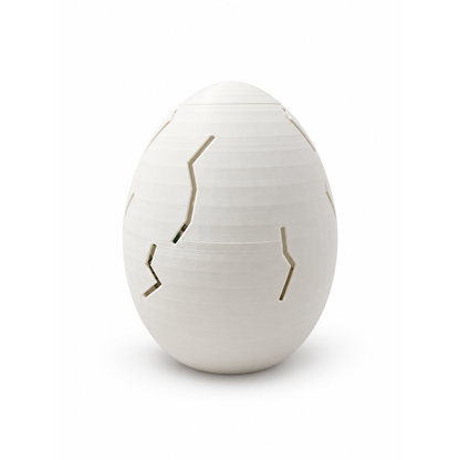 Closed white outer egg included with the Little Hatchling Dino Clicker and Dino & Me duo
