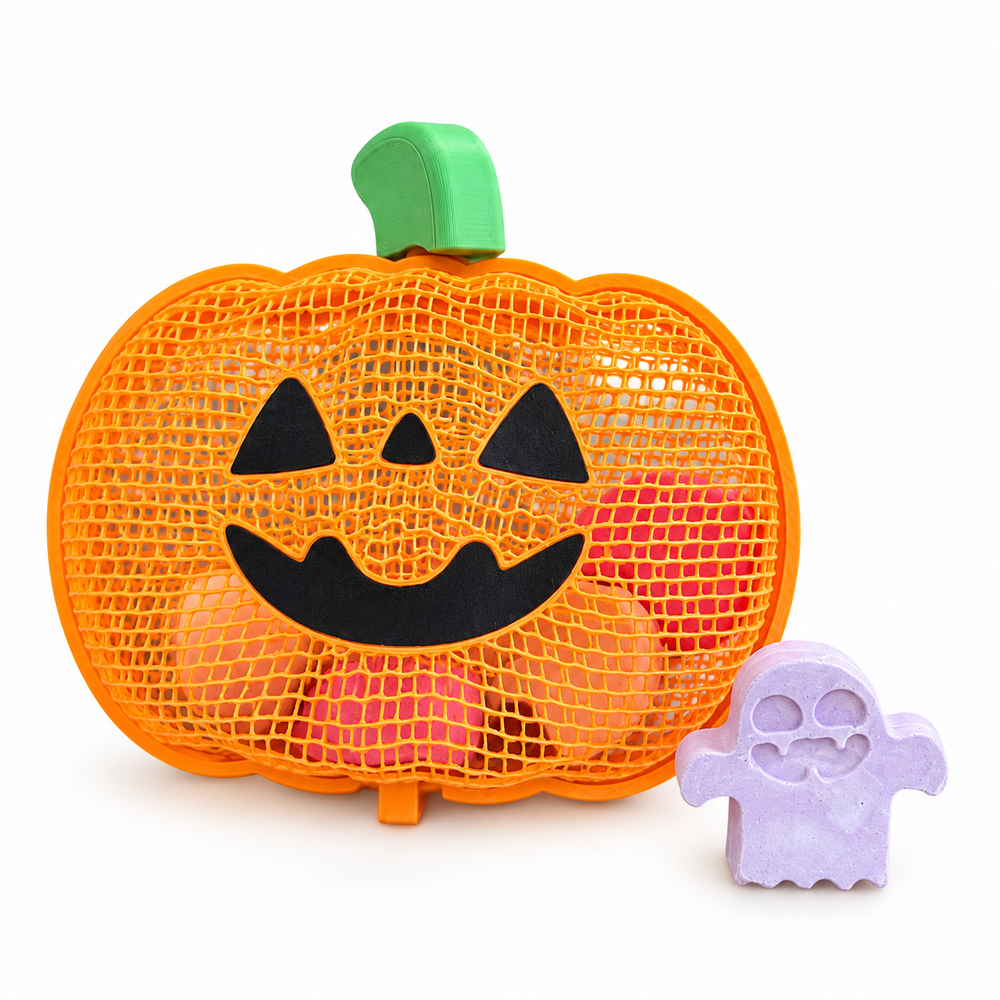 Pumpkin-shaped Halloween chalk case beside a purple ghost chalk piece