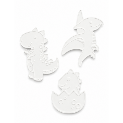 The three unpainted 3D dinosaur figures included in the kit