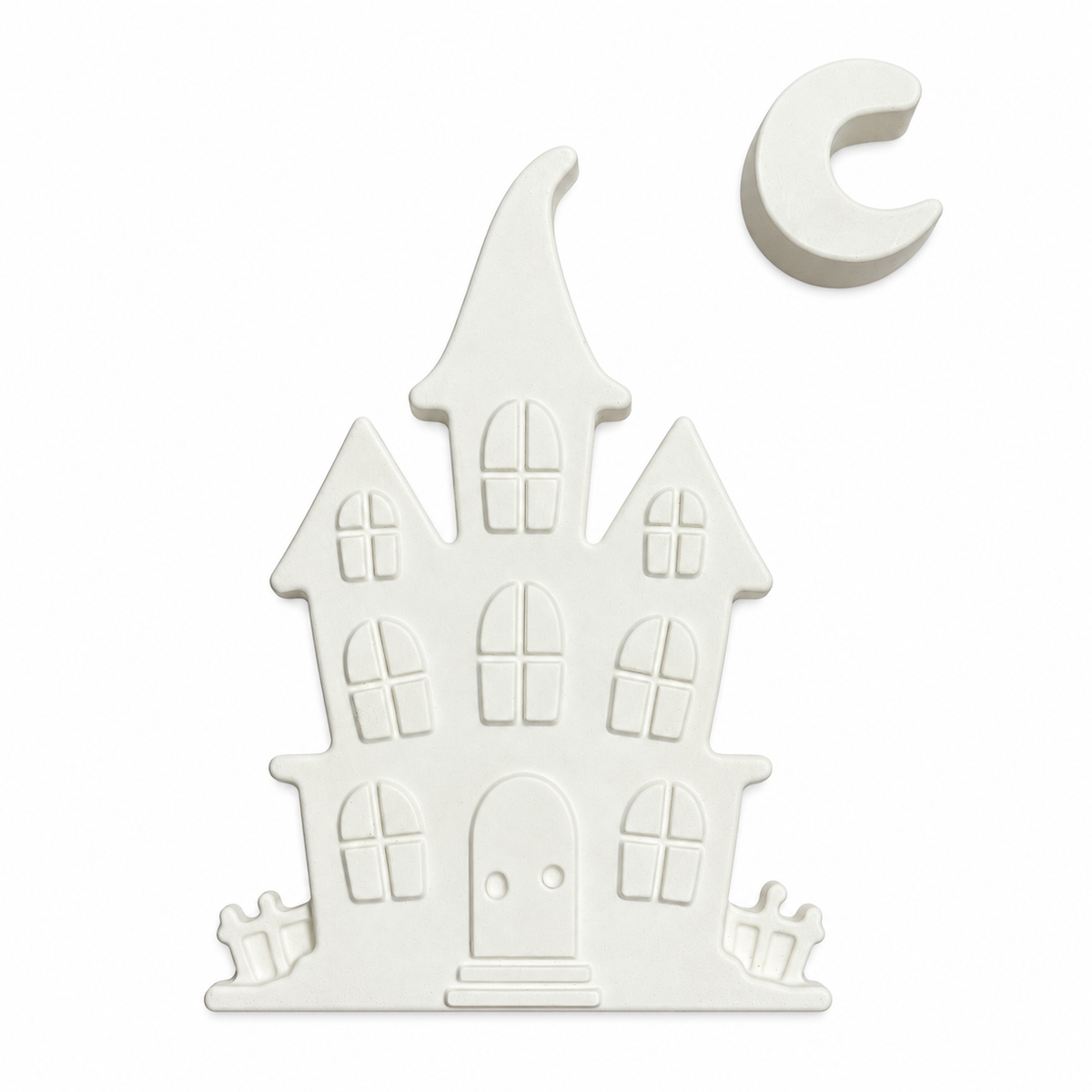 haunted house and crescent moon in unpainted plaster on a white background