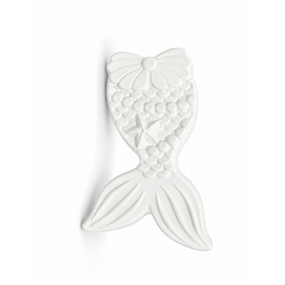 mermaid tail in unpainted plaster on a white background