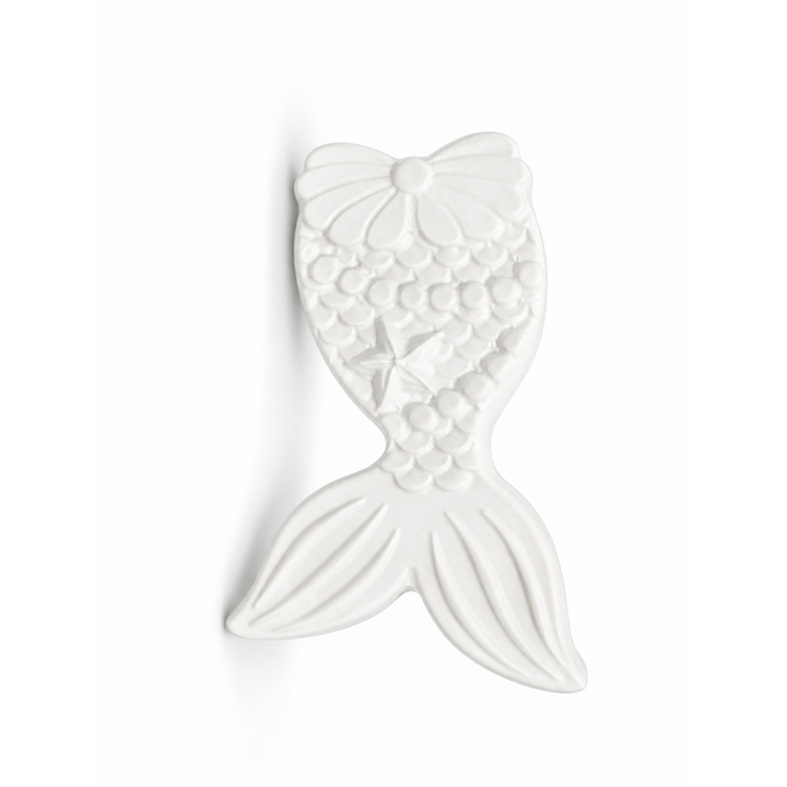mermaid tail in unpainted plaster on a white background
