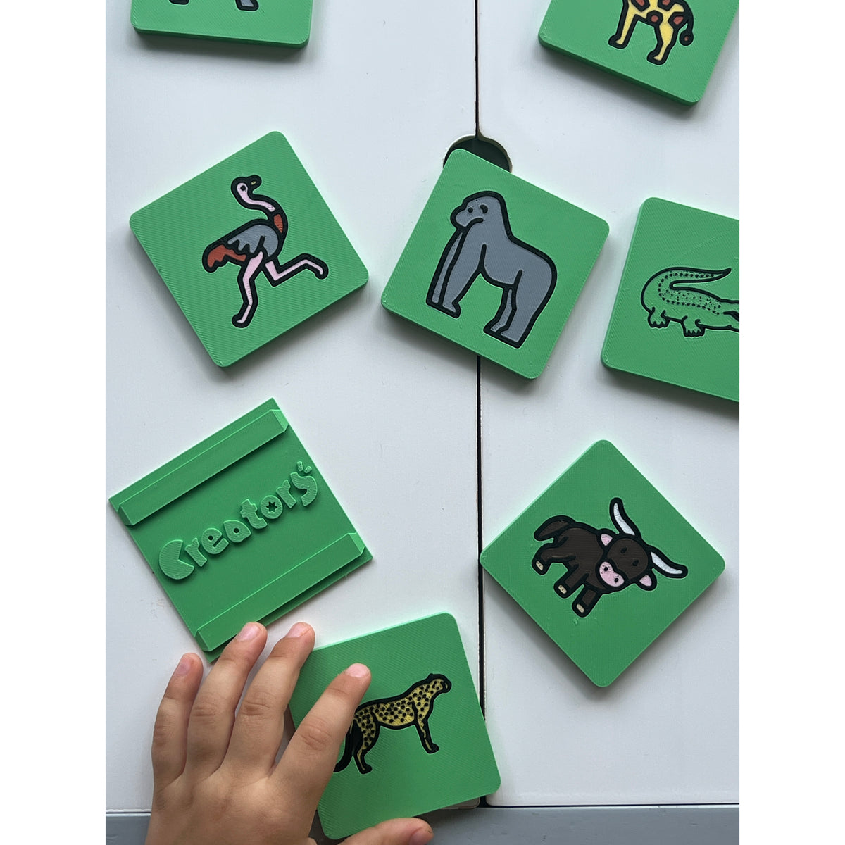 Safari Discovery 3D Puzzle real photo - child playing with tiles