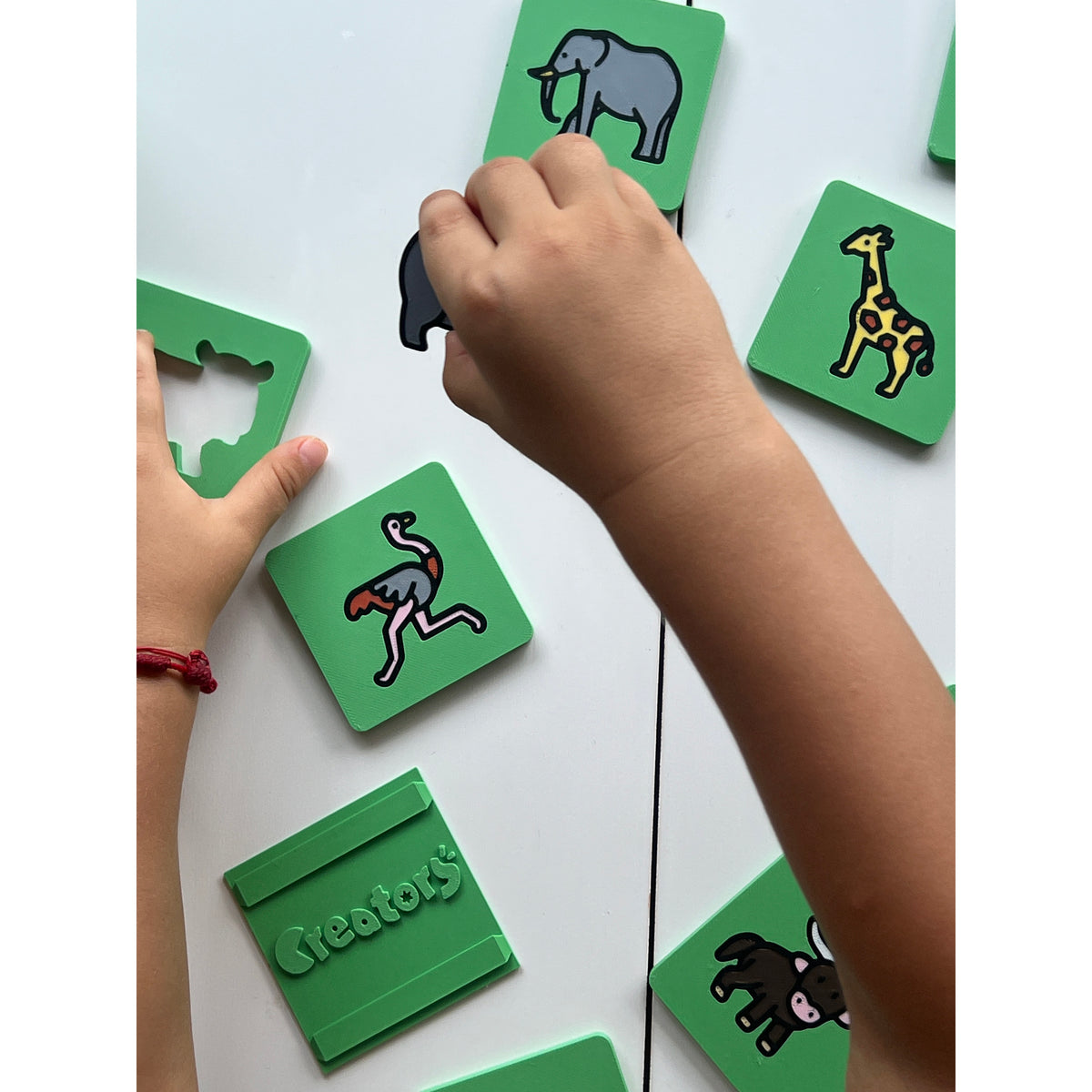 Safari Discovery 3D Puzzle real photo - child reaching for tiles