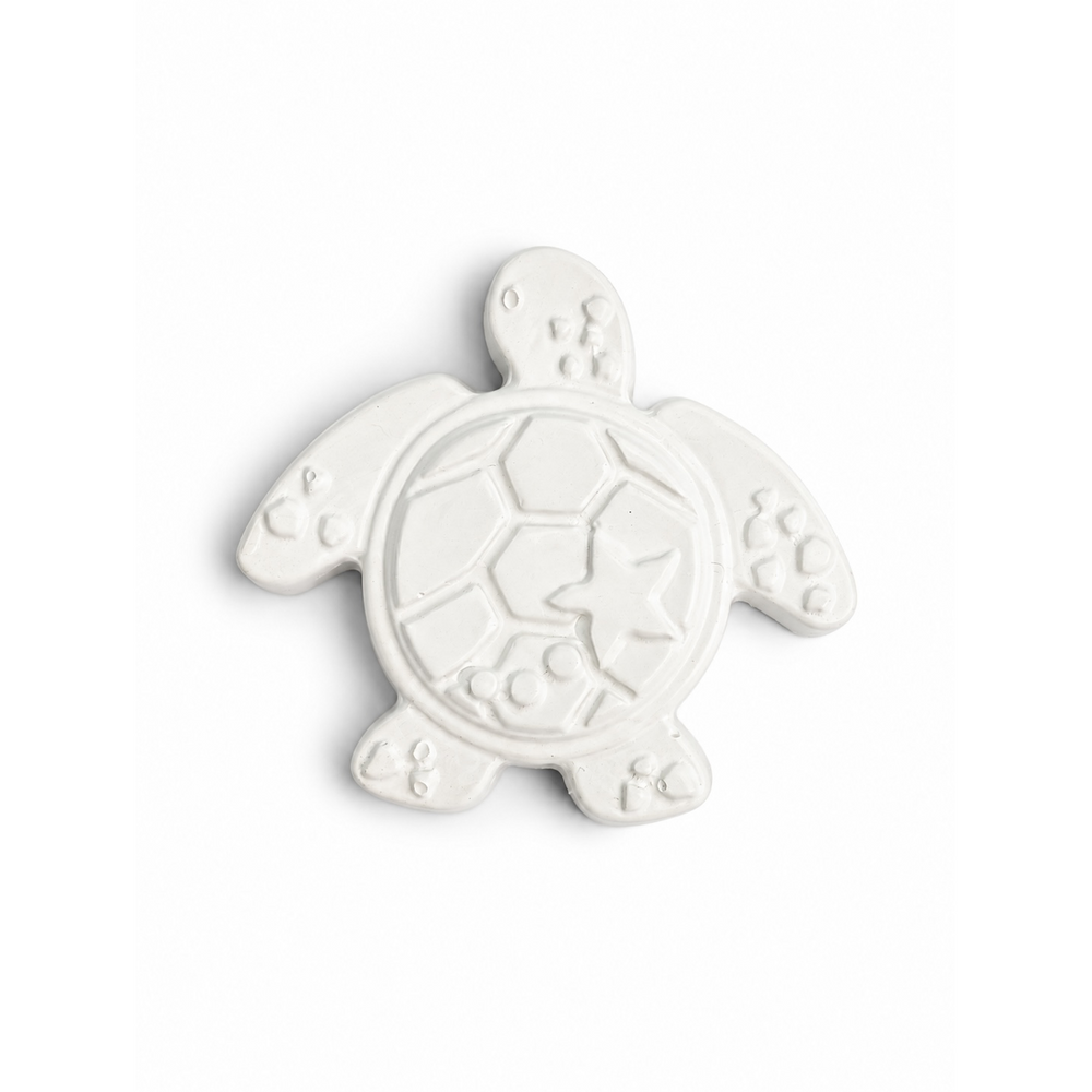 sea turtle in unpainted plaster on a white background