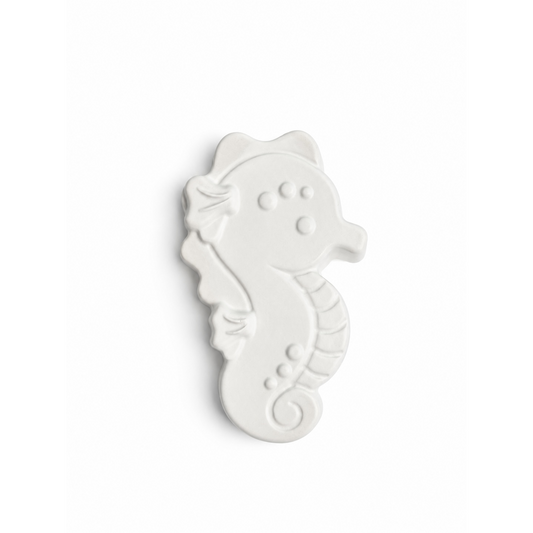 seahorse in unpainted plaster on a white background
