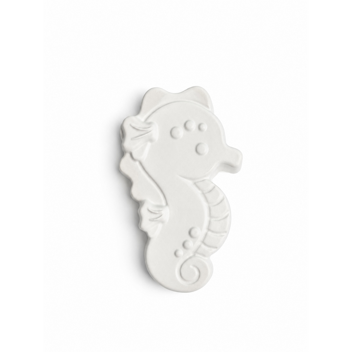 seahorse in unpainted plaster on a white background
